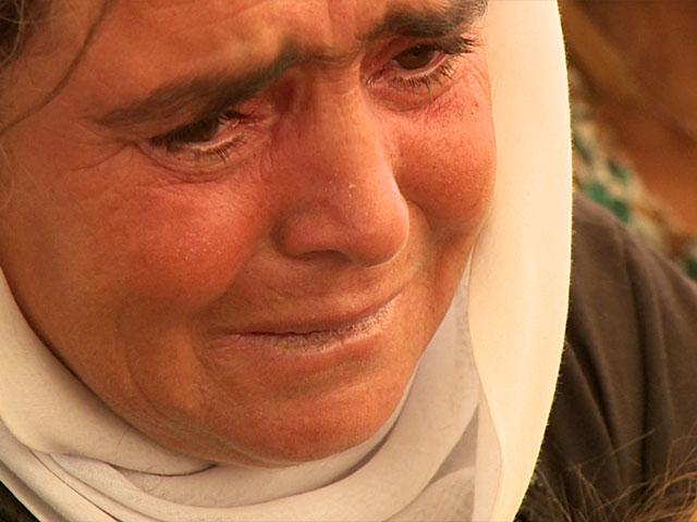 Yazidi mother weeps, CBN News image, Jonathan Goff