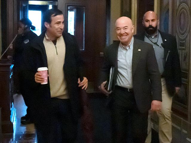 Homeland Security Secretary Alejandro Mayorkas arrives at the Capitol, Dec. 17, 2023. (AP Photo/Mark Schiefelbein)