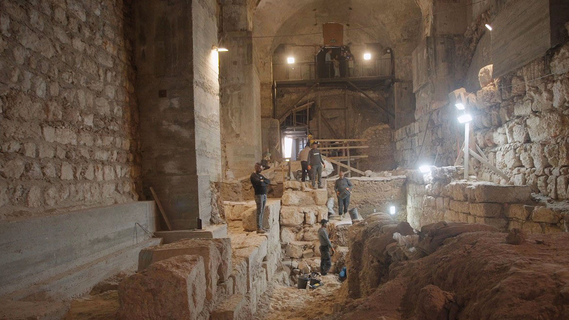 Uncovering of the Hasmonean wall segment in the Kishle (winter shelter). Photo Credit:  Gabriel Volcovich.