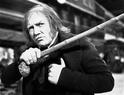 This Jan. 15, 1970 photo shows British actor Albert Finney playing the title role in the film "Scrooge". The film is a musical based on the Charles Dickens book "A Christmas Carol". (AP Photo/Bob Dear, FILE)
