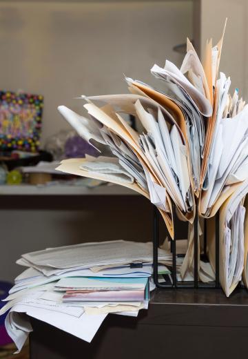 Cluttered messy office desk