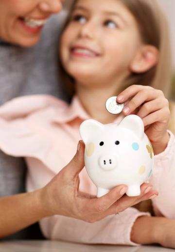 Mom and child with piggy bank