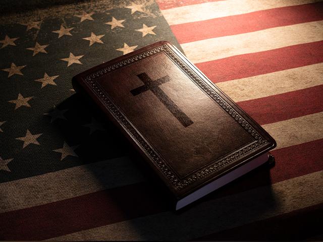 A Bible on top of an American flag 