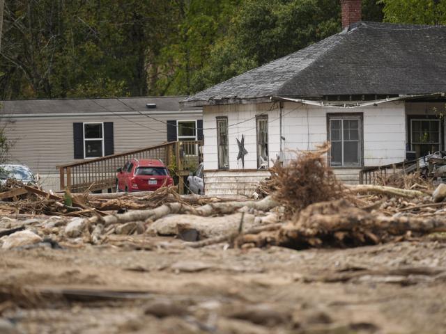 Homes lie in a debris field in the aftermath of Hurricane Helene, Thursday, Oct. 3, 2024, in Pensacola, N.C. (AP Photo/Mike Stewart)