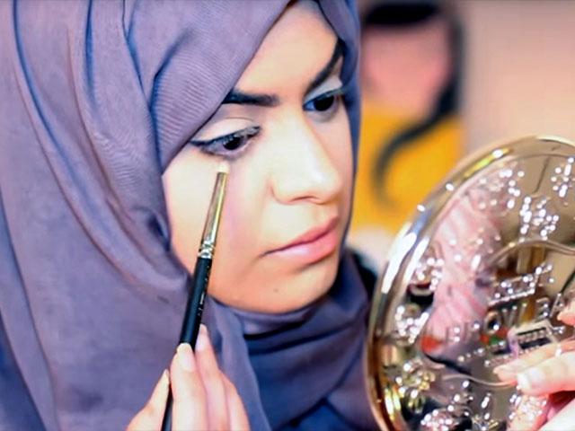 Arab Woman putting on makeup