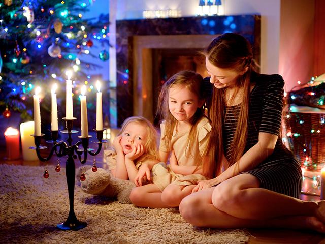 mother and children at Christmas with candles