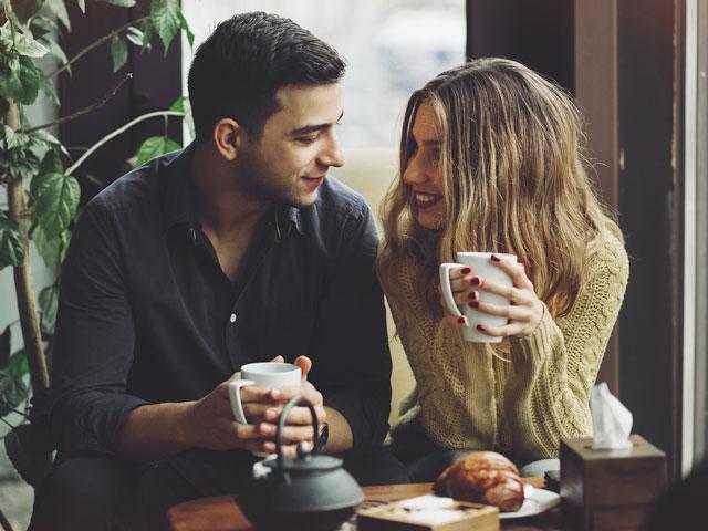 Dating couple drinking coffee