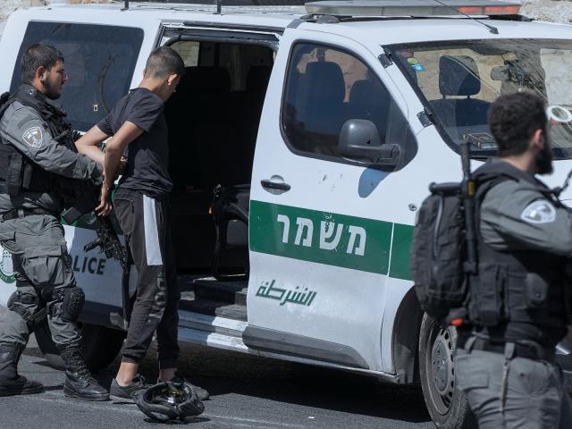Israeli security forces arrest a Palestinian outside Jerusalem's Old City, Friday, Oct. 13, 2023.  (AP Photo/Mahmoud Illean)