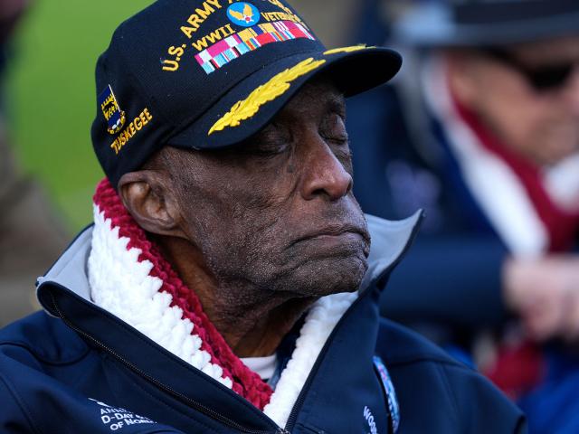 U.S. WW II veteran and Tuskegee Airman, Enoch "Woody" Woodhouse listens to Amazing Grace during a service at the Normandy American Cemetery in Colleville-sur-Mer, France, June 4, 2024 (AP Photo/Virginia Mayo)