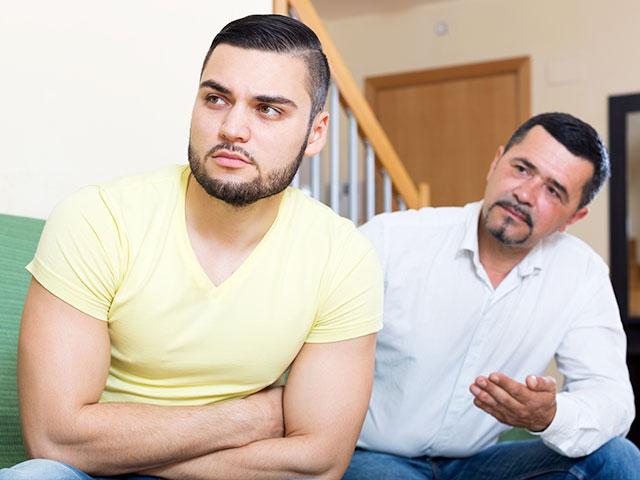 Dad talking with grown-up son about sex
