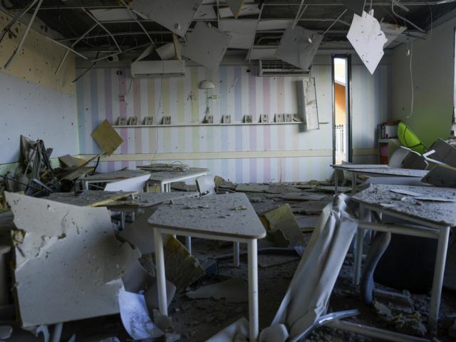 A damaged school building is seen after it was hit in Iran's missile attack in Gedera, Israel, Wednesday, Oct. 2, 2024. (AP Photo/Ohad Zwigenberg)