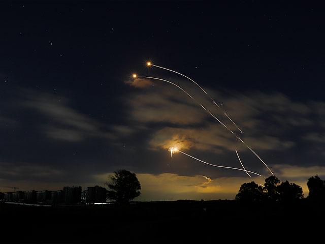 Israeli Iron Dome air defense system launches to intercept rockets fired from Gaza Strip, near Sderot, Israel, Thursday, May 13, 2021. (AP Photo/Ariel Schalit)