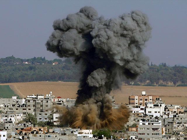 In this May 11, 2021, file photo, smoke rises after an Israeli airstrike in Gaza City.