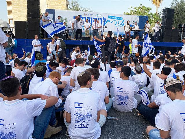 Israelis sitting down after Red Alert siren on Jerusalem Day. Photo Credit: CBN News