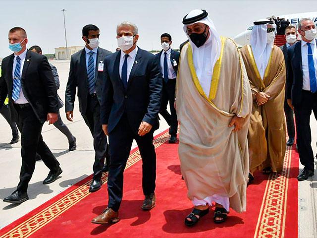 Israeli Foreign Minister Yair Lapid arrives in Abu Dhabi, United Arab Emirates, Tuesday, June 29, 2021. Photo Credit: Shlomi Amsalem/GPO via AP.