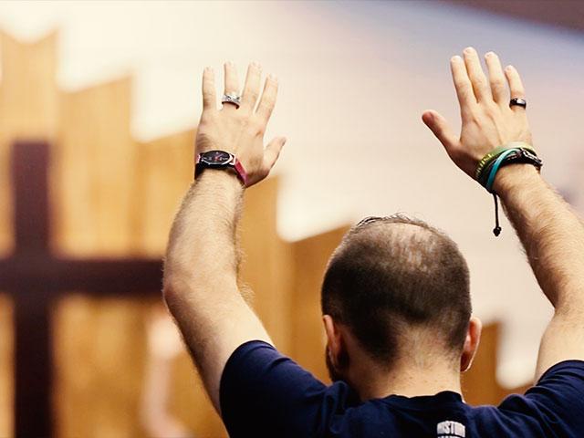 Man in church, praise and worship