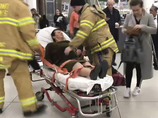 In this still image taken from video , emergency medical personnel tend to an injured passenger from a Turkish Airlines flight at New York&#039;s John F. Kennedy International Airport, Saturday, March 9, 2019.(WNBC-TV News 4 New York via AP)