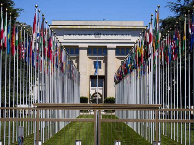 Flagpoles line in rows in front of a building of the United Nations in Geneva, Switzerland Monday, June 14, 2021. AP Photo