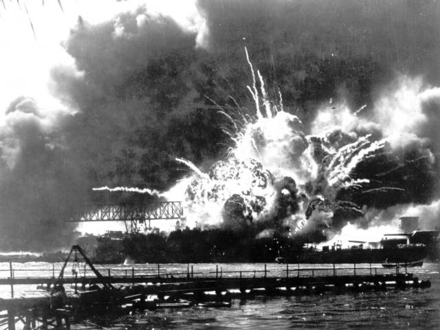 In this photo released by the U.S. Navy, the destroyer USS Shaw explodes after being hit by bombs during the Japanese surprise attack on Pearl Harbor, Hawaii, December 7, 1941. (U.S. Navy via AP)