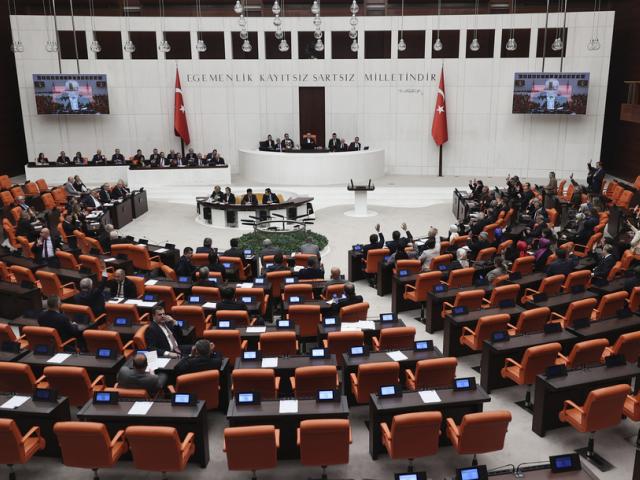 Turkish lawmakers vote in favor of Finland&#039;s bid to join NATO, late Thursday, March 30, 2023, at the parliament in Ankara, Turkey. (AP Photo/Burhan Ozbilici)