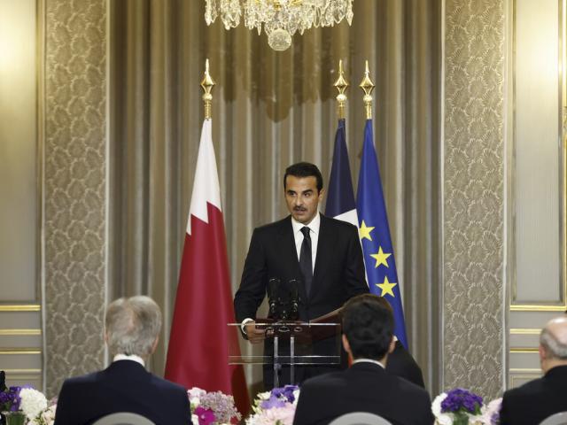 Qatar&#039;s Emir Sheikh Tamim bin Hamad Al Thani delivers a speech during a state dinner with French President Emmanuel Macron at the Elysee Palace in Paris, Tuesday, Feb. 27, 2024. (Yoan Valat, Pool via AP)