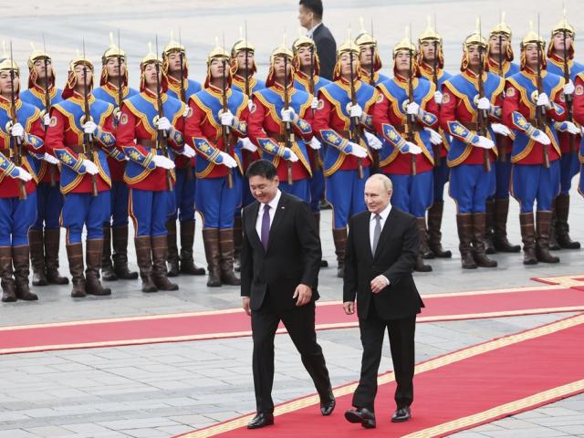 Russian President Vladimir Putin, right, walks with Mongolian President Ukhnaagiin Khurelsukh, left, during welcoming ceremony at Sukhbaatar Square in Ulaanbaatar, Mongolia, Tuesday, Sept. 3, 2024. (Sofya Sandurskaya, Sputnik, Kremlin Pool Photo via AP)