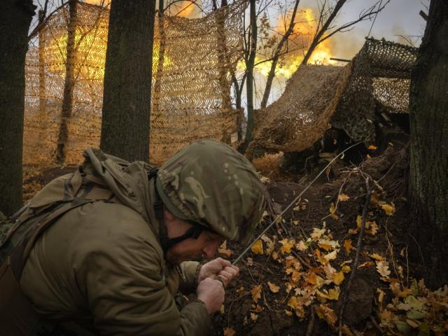 A serviceman of the 13th Brigade of the National Guard of Ukraine fires Giatsint-B gun towards Russian positions near Kharkiv, Ukraine, Wednesday, Nov. 6, 2024. (AP Photo/Efrem Lukatsky)