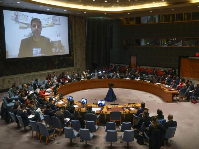 Michael Levy, left on screen, who is the brother of Hamas hostage Or Levy, speaks during a Security Council meeting at United Nations headquarters, Wednesday, Dec. 18, 2024. (AP Photo/Seth Wenig)