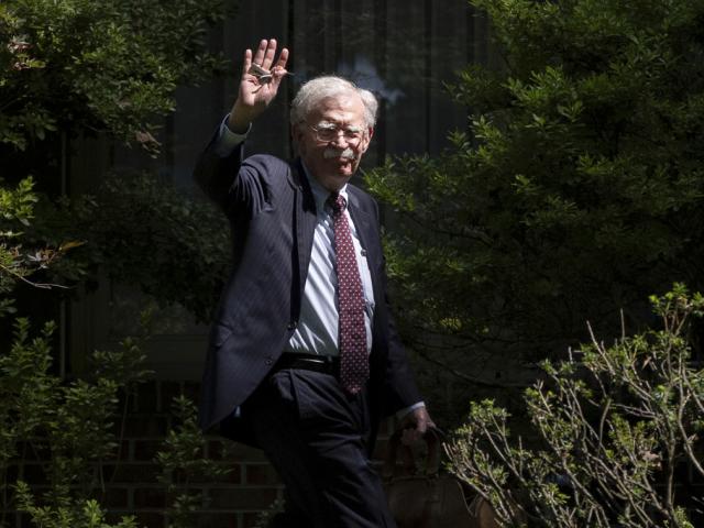 FILE - Former national security adviser John Bolton waves as he arrives at his house Aug. 22, 2025, in Bethesda, Md. (AP Photo/Manuel Balce Ceneta, File) FILE - Former national security adviser John Bolton waves as he arrives at his house Aug. 22, 2025, in Bethesda, Md. (AP Photo/Manuel Balce Ceneta, File)