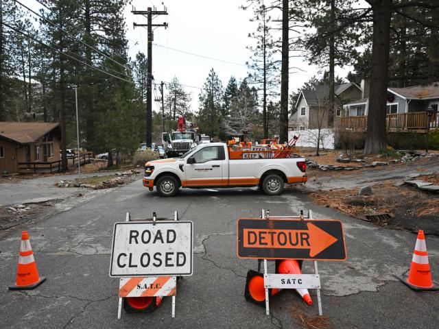 Workers work to restore power after severe storms, Thursday, Dec. 25, 2025, in Wrightwood, Calif. (AP Photo/William Liang) Workers work to restore power after severe storms, Thursday, Dec. 25, 2025, in Wrightwood, Calif. (AP Photo/William Liang)