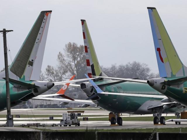  In this file photo Boeing 737 MAX 8 planes are parked near Boeing Co.&#039;s 737 assembly facility in Renton, Wash. Investigators were rushing to the scene of a devastating plane crash in Ethiopia on Sunday, March 10, 2019. (AP Photo/Ted S. Warren File)