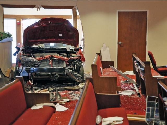 The car that crashed into the entrance of the Crossroads United Methodist Church in Columbus, Ohio during Sunday morning services is visible from inside of the church.