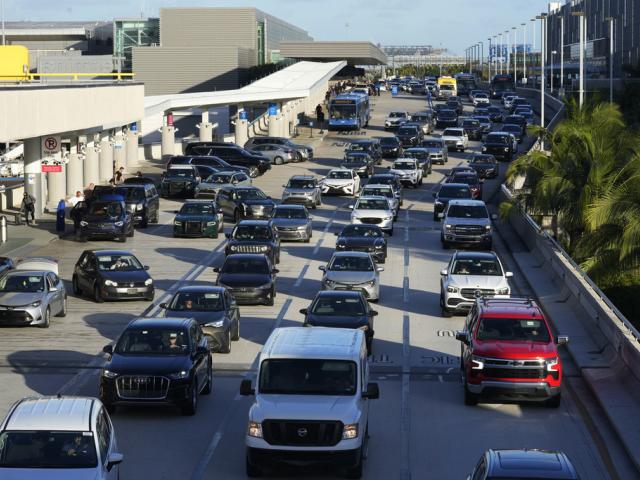 Cars line up to drop off passengers at Fort Lauderdale-Hollywood International Airport, Nov. 21, 2023, in Florida. (AP Photo/Marta Lavandier).