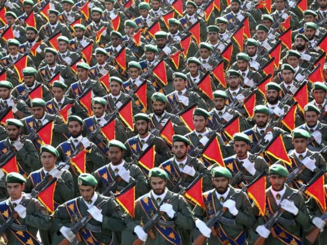 In this Sept. 21, 2016 file photo, Iran&#039;s Revolutionary Guard troops march in a military parade marking the 36th anniversary of Iraq&#039;s 1980 invasion of Iran. (AP Photo/Ebrahim Noroozi, File)