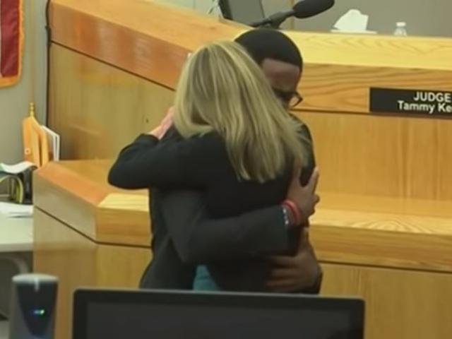 Botham Jean&#039;s brother Brandt embraces former Dallas Police officer Amber Guyger who was sentenced to 10 years for killing his brother. (Screenshot credit: AP) 