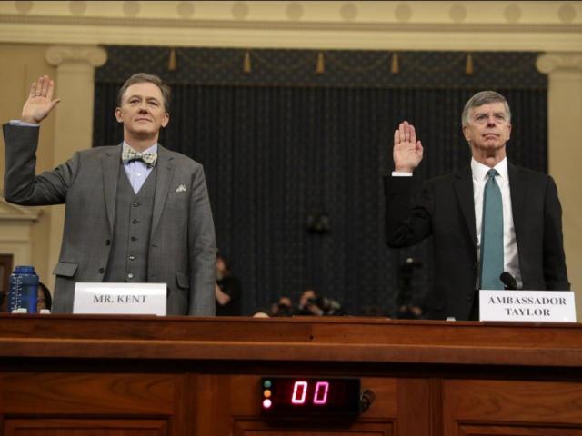 Career Foreign Service officer George Kent and top U.S. diplomat in Ukraine William Taylor, right, are sworn in to testify during the first public impeachment hearing of the House Intelligence Committee on Capitol Hill, Wednesday in Washington. (AP Photo)