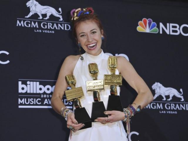 Lauren Daigle poses with the awards for top christian artist, top christian song for &quot;You Say,&quot; top christian album for &quot;Look Up Child, &quot;at the Billboard Music Awards at the MGM Grand Garden Arena in Las Vegas last May. (Photo by Richard Shotwell/AP file)