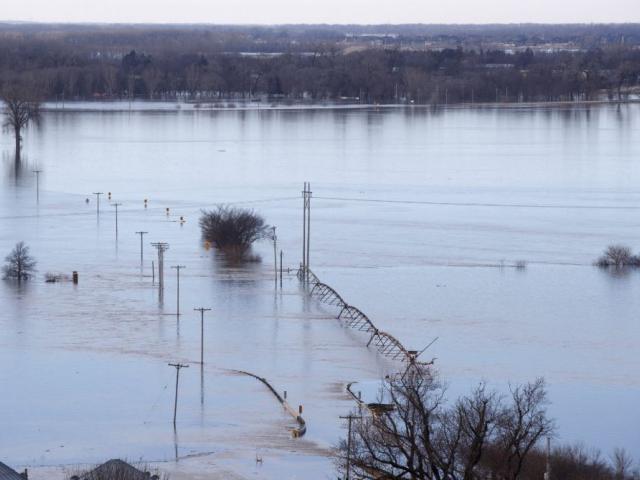 Looking southwest towards Waterloo Neb., high waters from the Elkhorn river cover Maple street in the distance Saturday March 16, 2019.  (Jeff Bundy/Omaha World-Herald via AP) 