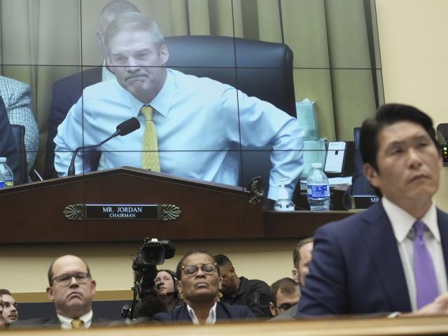 PHOTO: Department of Justice Special Counsel Robert Hur, right, testifies on Capitol Hill, March 12, 2024. House Judiciary Committee Chair Rep. Jim Jordan, R-Ohio, is shown on the rear screen. (AP Photo/Jacquelyn Martin)