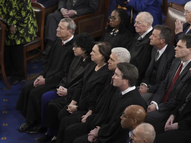 Supreme Court Justices listen as President Joe Biden delivers his State of the Union address to a joint session of Congress, at the Capitol in Washington, Thursday, March 7, 2024. (AP Photo/J. Scott Applewhite)