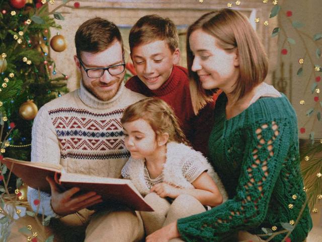 A joyful family sitting around the Christams tree