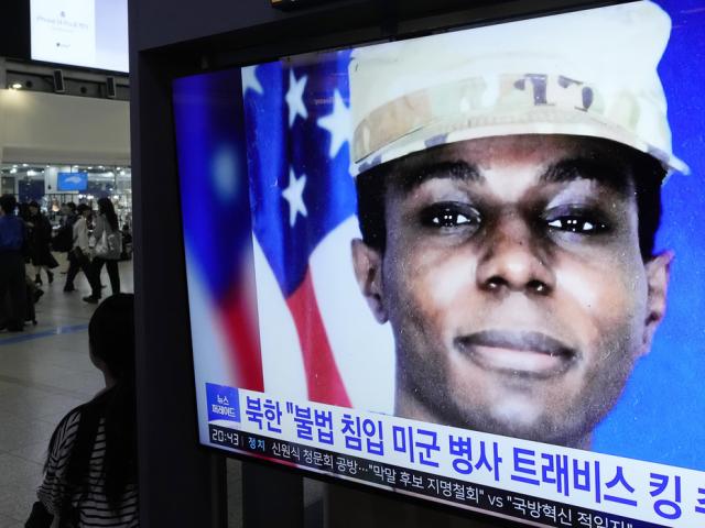 A TV screen shows a file image of American soldier Travis King during a news program in Seoul, South Korea, Wednesday, Sept. 27, 2023.  (AP Photo/Ahn Young-joon)