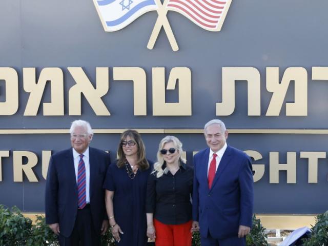 Israeli Prime Minister Benjamin Netanyahu, right, his wife Sara , United States Ambassador to Israel David Friedman, left, his wife Tammy pose during the inauguration of a new settlement named after President Donald Trump in the Golan Heights.