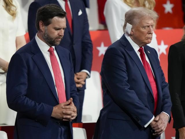 Republican presidential candidate former President Donald Trump and Republican vice presidential candidate Sen. JD Vance, R-Ohio, pray during the Republican National Convention Thursday, July 18, 2024, in Milwaukee. (AP Photo/Charles Rex Arbogast)