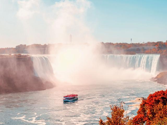A boat sailing in the glorious sunlight. 
