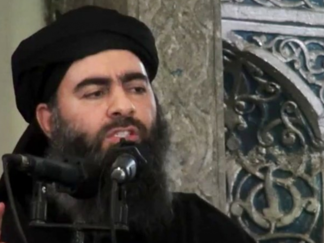 Abu Bakr al-Baghdadi delivering a sermon at a mosque in Iraq during his first public appearance (AP Photo/Militant video, File)