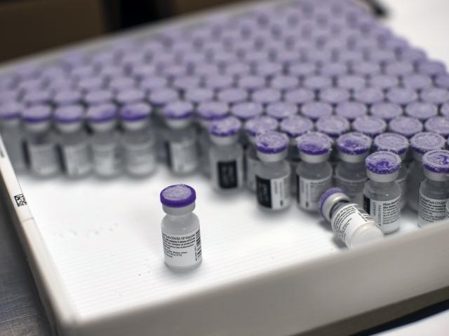 In this Monday, Jan. 4, 2021 file photo, frozen vials of the Pfizer/BioNTech COVID-19 vaccine are taken out to thaw, at the MontLegia CHC hospital in Liege, Belgium.(AP Photo/Francisco Seco, File)