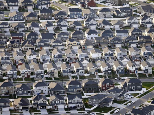 FILE - Rows of homes, are shown in suburban Salt Lake City, on April 13, 2019. (AP Photo/Rick Bowmer, File)