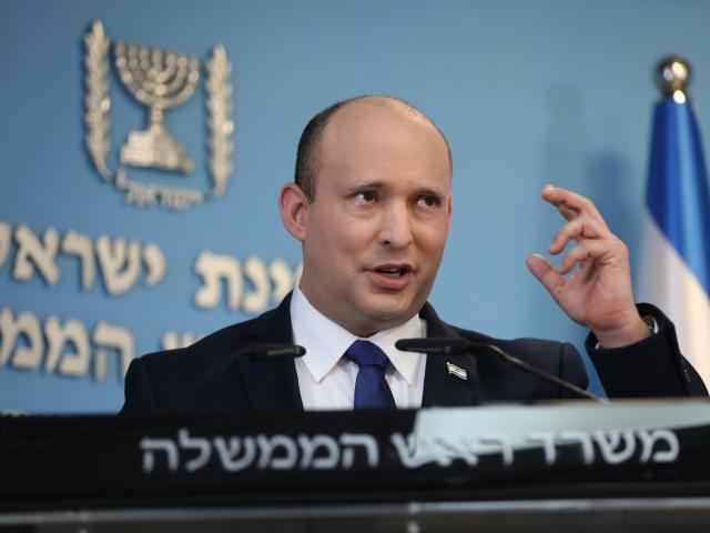 Israeli Prime Minister Naftali Bennett speaks during a news conference regarding COVID-19 pandemic in the country on Wednesday, Aug. 18, 2021 in Jerusalem. (Abir Sultan/Pool Photo via AP)
