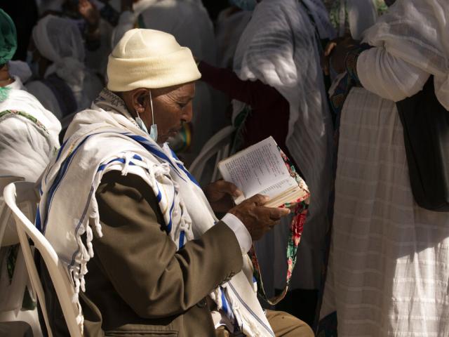 An Ethiopian Jewish man prays as the faithful gather on the holiday of Sigd in Jerusalem, Thursday, Nov. 4, 2021. (AP Photo/Maya Alleruzzo)
